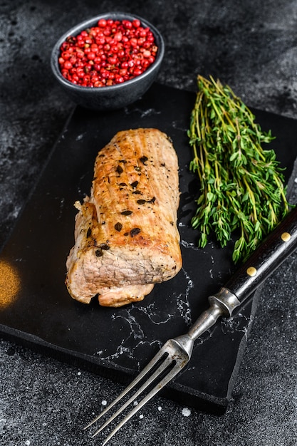 Whole barbecue baked pork tenderloin. 