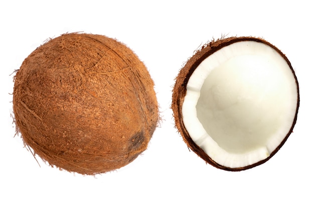 Whole coconut and pieces of coconut on isolated background