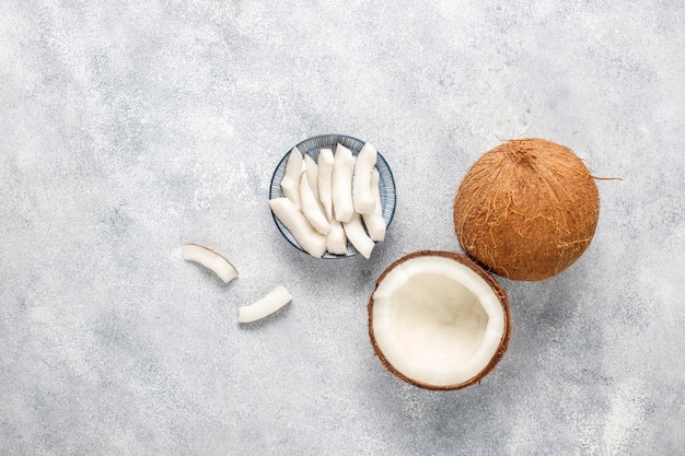 Whole coconut and various pieces of coconut