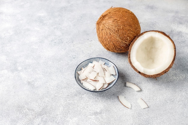 Whole coconut and various pieces of coconut