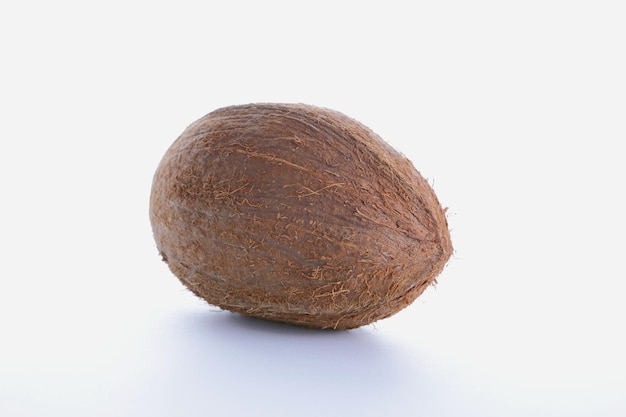 Whole coconut on white. Coconut lying on a white background