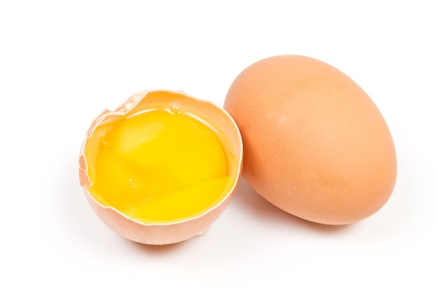 Whole egg and a broken isolated on white background