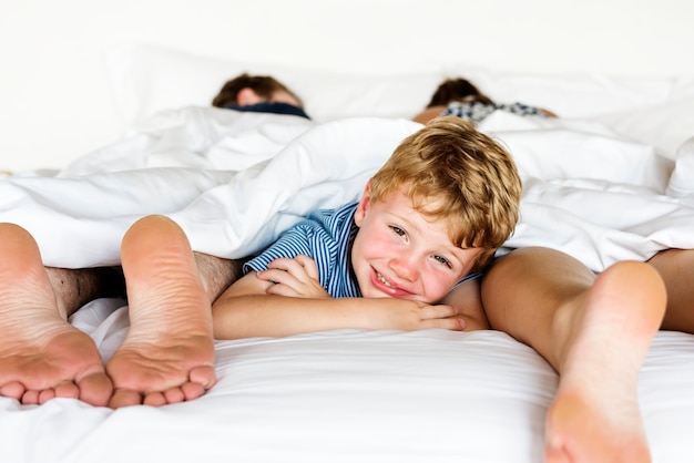 Whole family sharing a bed