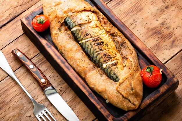 Whole fish baked in dough