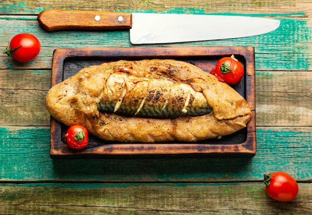 Whole fish baked in dough