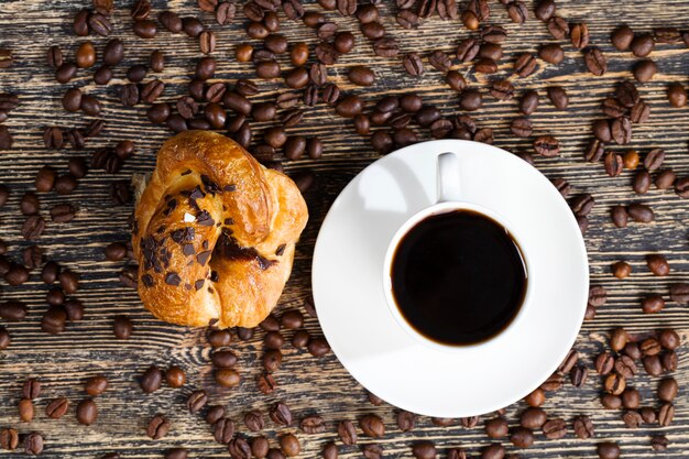 Whole and flavorful coffee beans scattered in a chaotic order