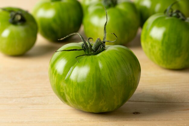 Whole fresh green zebra tomato close up