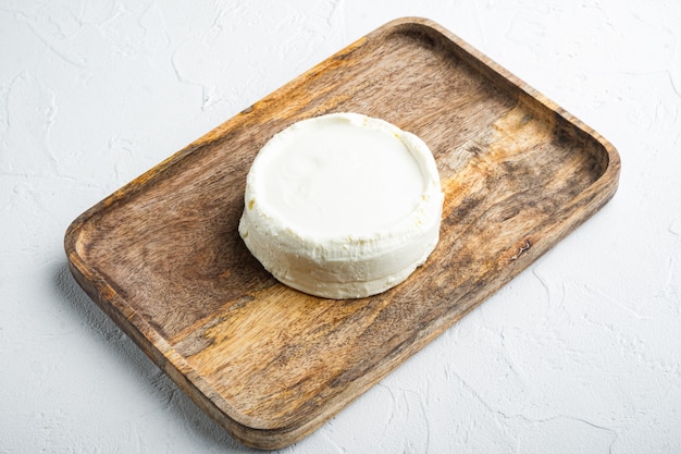 Whole fresh, ricotta cheese, on white