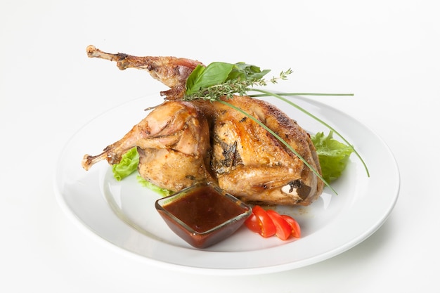 whole fried chicken on a wooden cutting board