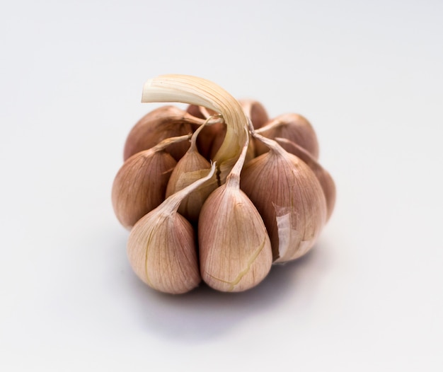Whole Garlic Clove on White table