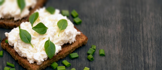 Whole grain bread with feta cheese and herbs.