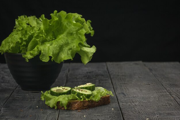 Whole grain bread with lettuce and cucumber. Healthy eating.