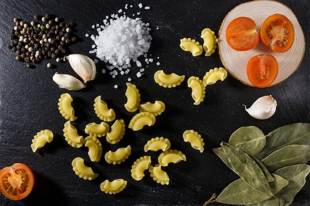 Whole grain raw Italian pasta and ingredients composition 