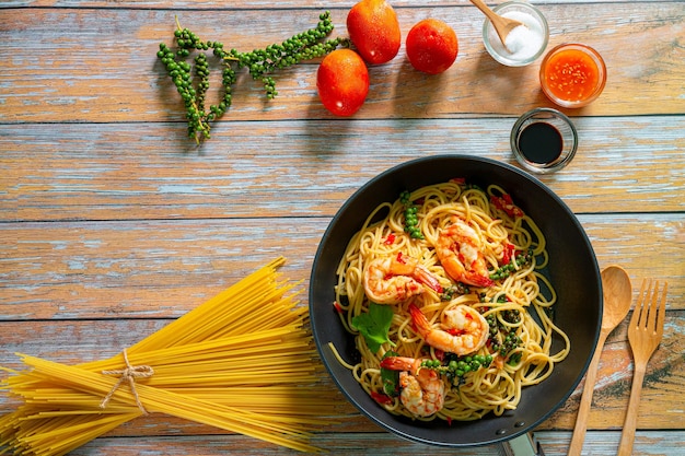 whole grain spaghetti pasta with shrimps top view copy space