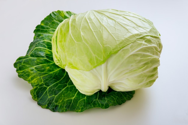 Whole green cabbage isolated on a white