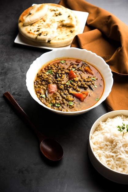 Whole Green Moong Dal fry or Whole Mung bean Tadka served in a bowl. selective focus