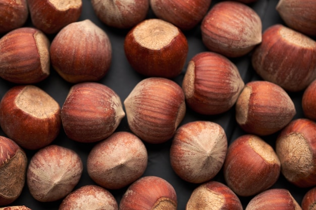 Whole hazelnuts nuts with shell closeup studio shot