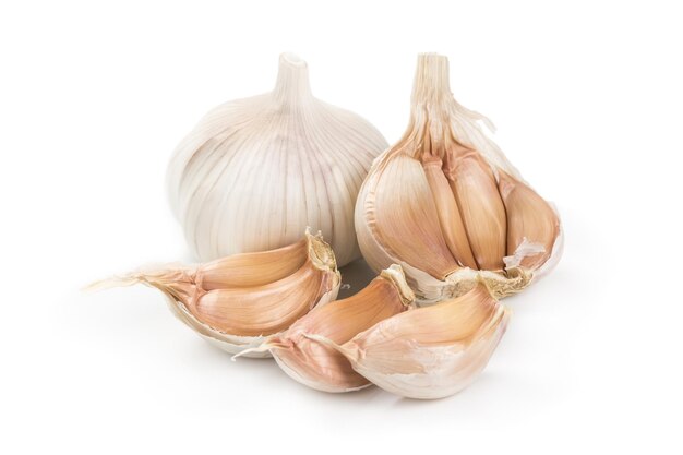 A whole head of garlic and cloves isolated on white background