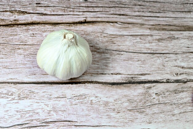 Whole head of garlic isolated on white background.