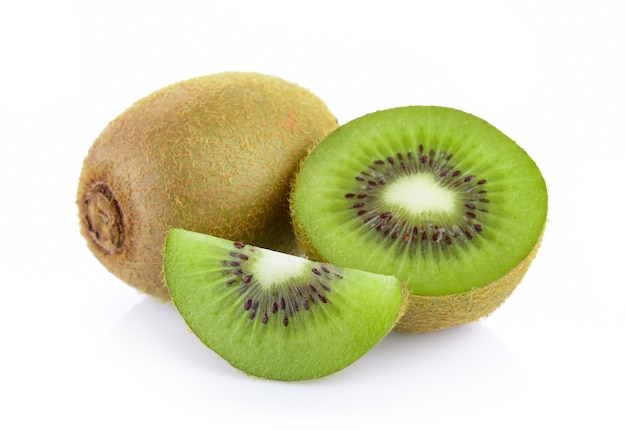 Whole kiwi fruit and his sliced segments on white background