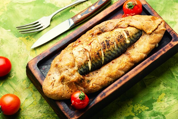 Whole mackerel roasted in dough