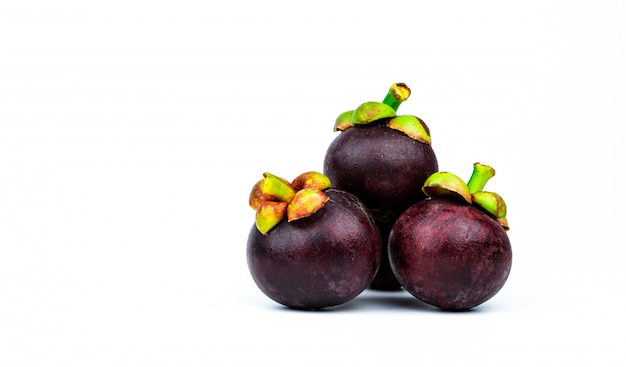 Whole mangosteen showing purple skin with space