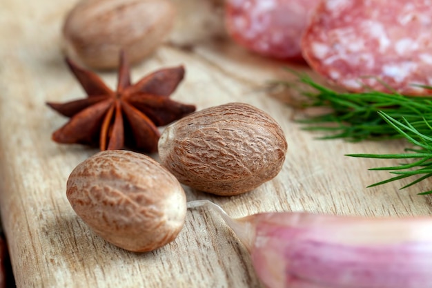 A whole nutmeg on a wooden board