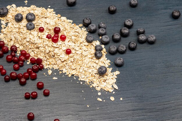 Whole oatmeal blueberries and cranberries on table