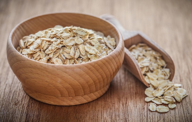 Whole oats closeup on textured natural surface