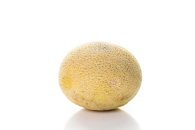 Whole organic cantaloupe on a white background.