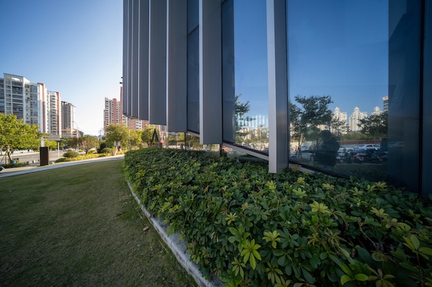 Photo the whole or part of modern architecture with glass and steel structure under backlight