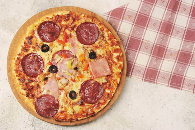 whole pizza with salami top view