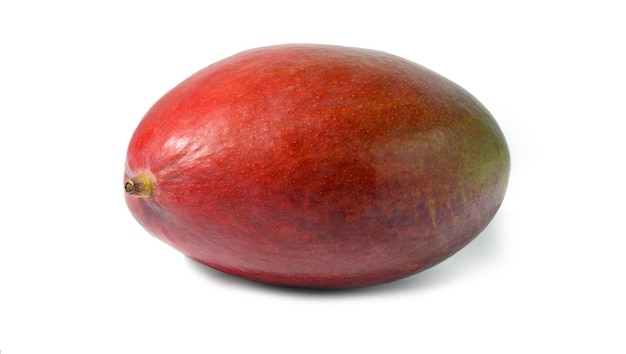 Whole ripe mango on a white isolated background