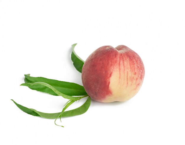 Whole ripe red peach isolated on a white background, close up