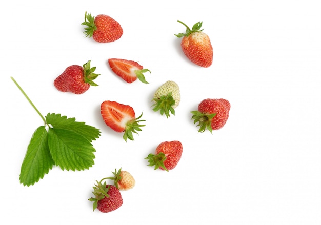 Whole ripe red strawberries with green leaf isolated on white background