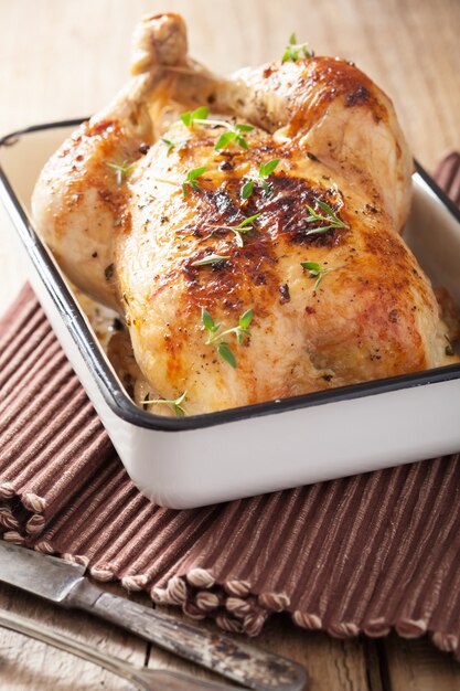 Whole roasted chicken with pepper and thyme