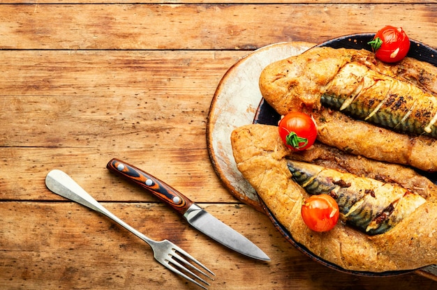 Whole scomber fish baked in puff pastry