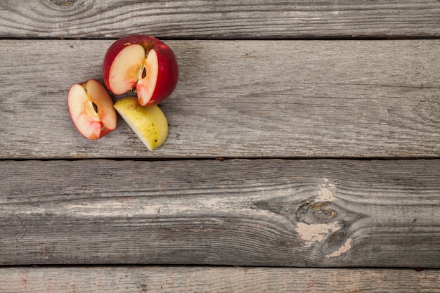 whole and sliced Apples on wood table