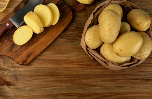 Whole and sliced potatoes top view