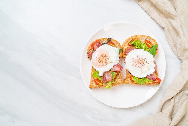 whole wheat bread toasted with vegetable, bacon and egg