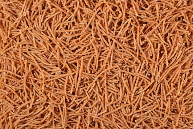 Whole wheat uncooked brown vermicelli  background