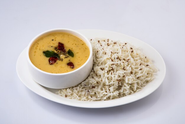 Whole Yellow Lentil dal tadka or fry with Jeera Rice, selective focus