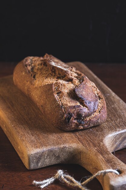 Wholemeal bread sliced on a wooden board 