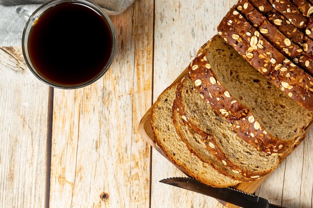 wholemeal bread topview slices over wooden table