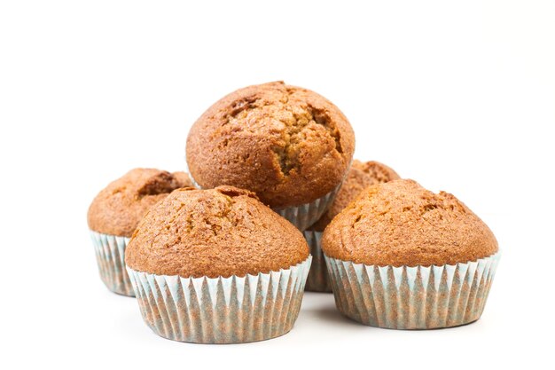 Wholemeal cupcakes in a close up view on white