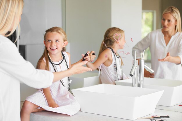 Why did you do this Little girl in the bathroom in trouble for drawing on the mirror