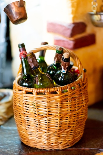 Wicker basket with bottles of wine.