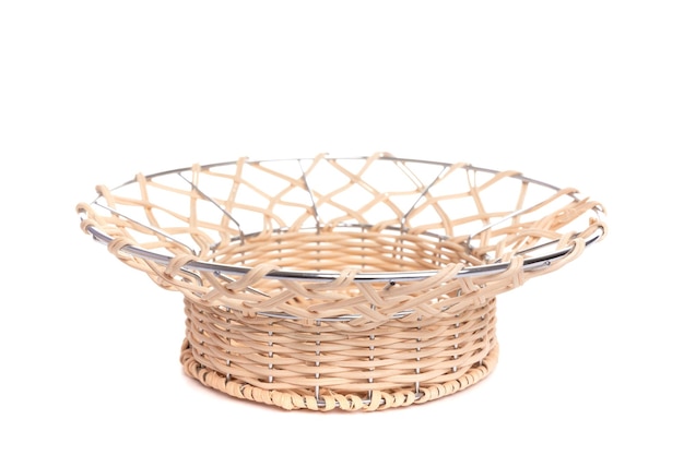 wicker basket with chromeplated metal on a white background