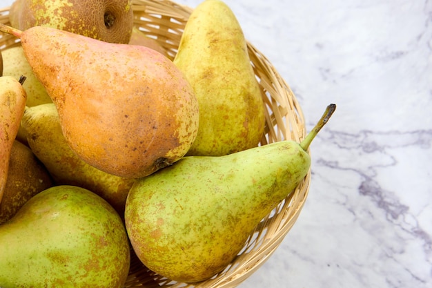 wicker basket with fresh conference pears