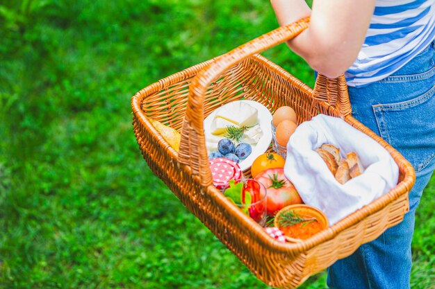 Wicker Basket with Fresh Picnic Food